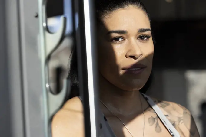 Portrait of woman looking into camera during workout.