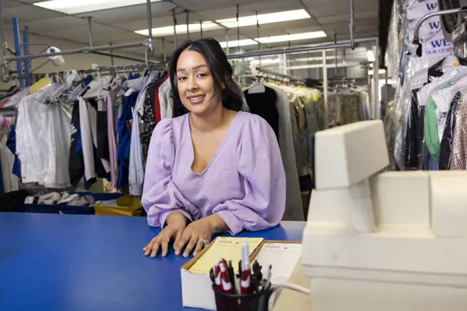 Portrait of dry cleaning shop owner