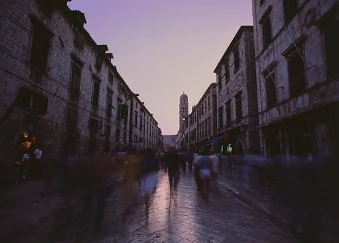 People on a busy street at dusk, Dubrovnik, Croatia