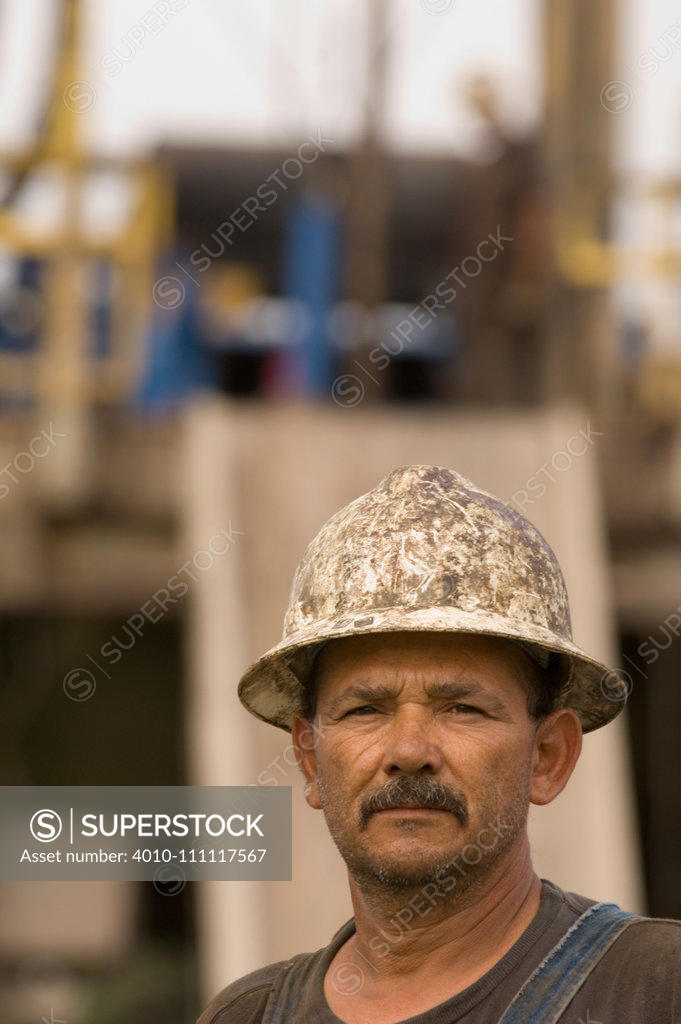 Men at work with hard hats - SuperStock