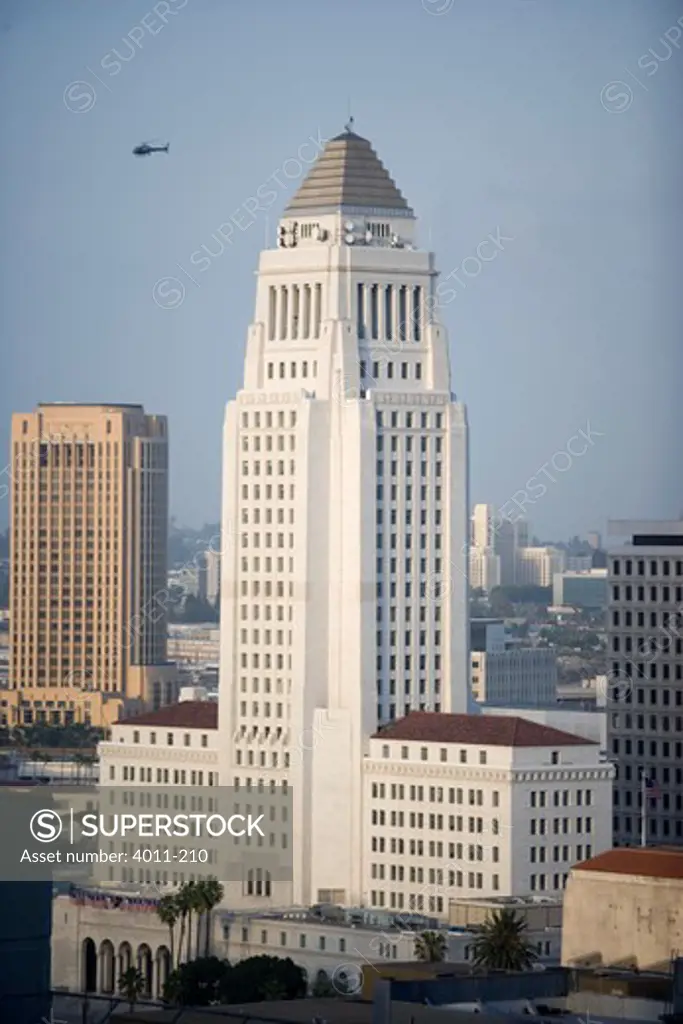 USA, California, Los Angeles, high angle view of city hall with helicopter in air