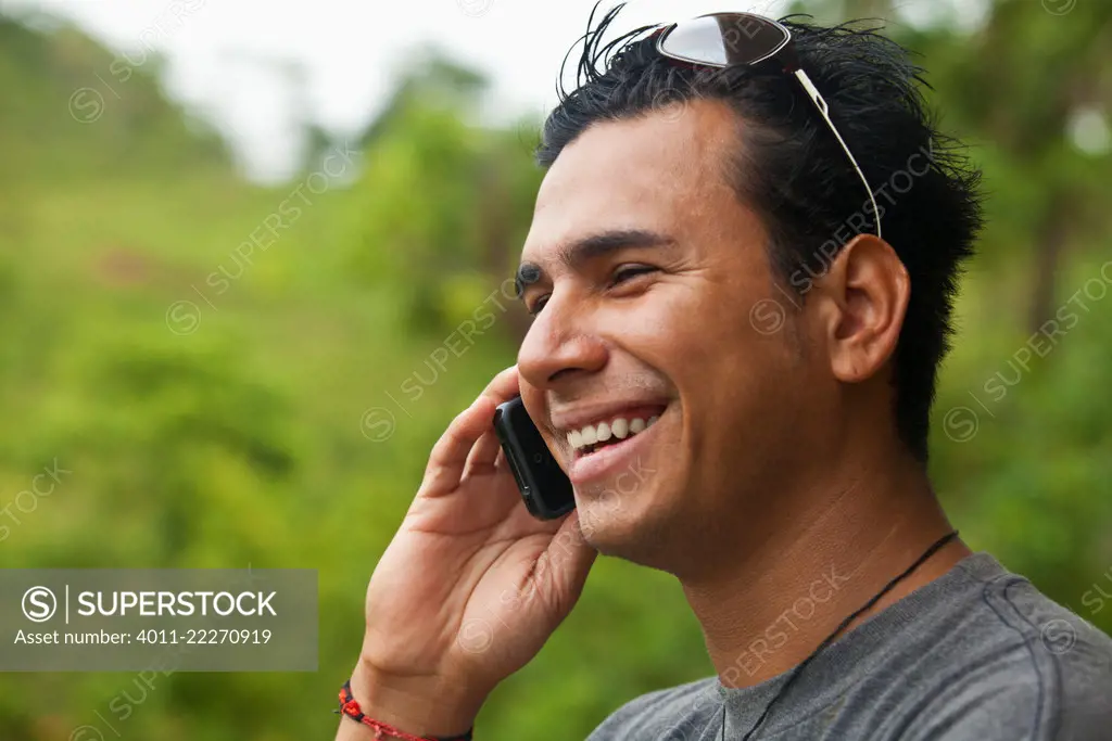 Hispanic man talking on cell phone