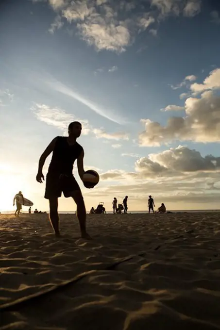 Man playing beach volleyball on the beach, Costa Rica