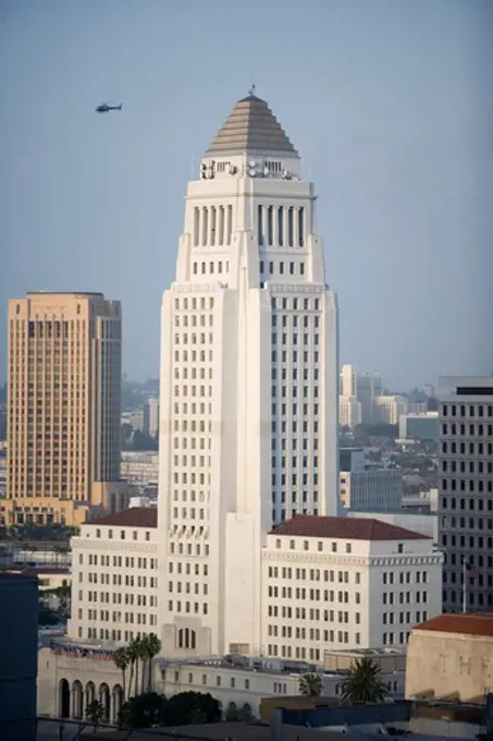 USA, California, Los Angeles, high angle view of city hall with helicopter in air