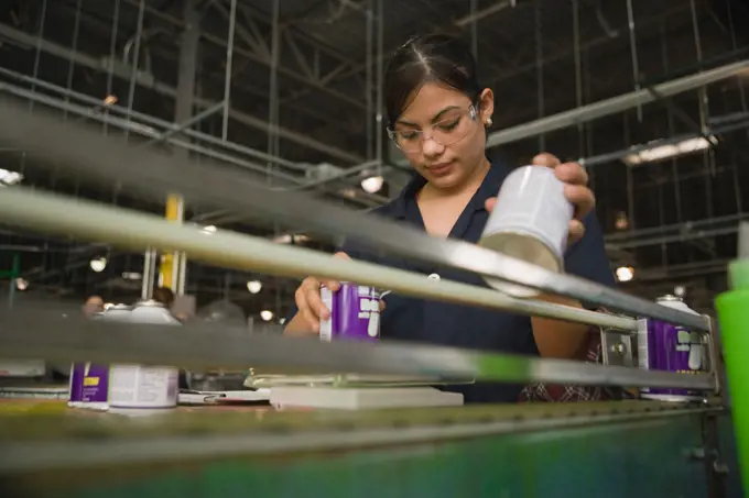 Hispanic woman working in manufacturing plant