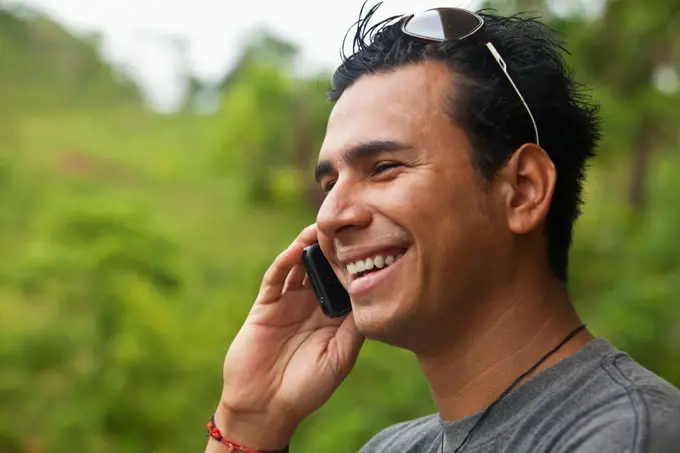 Hispanic man talking on cell phone