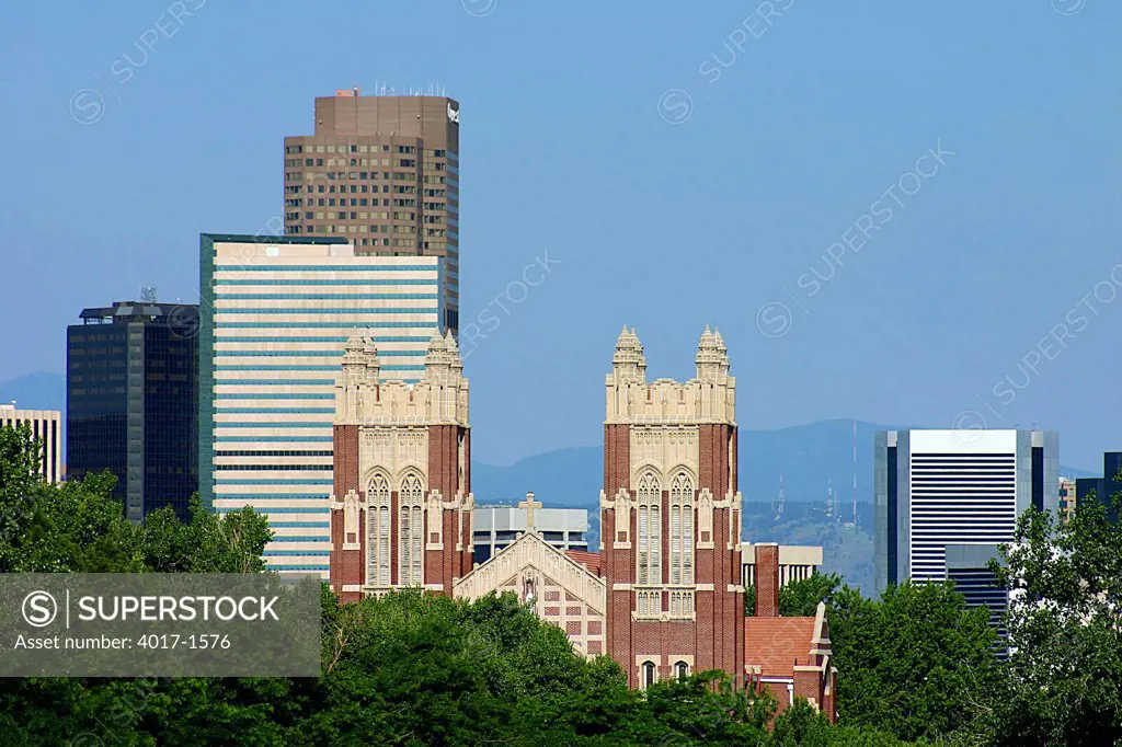 Downtown Denver and St Ignatius Loyola Catholic Church from City Park