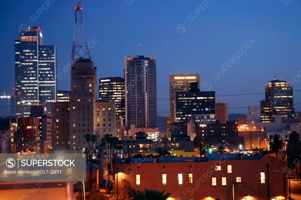 Skyscrapers lit up at night in a city, Phoenix, Arizona, USA