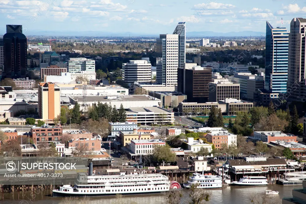 Aerial of the Downtown Skyline of Sacramento, California with the Delta King on the Sacramento River in the Foreground