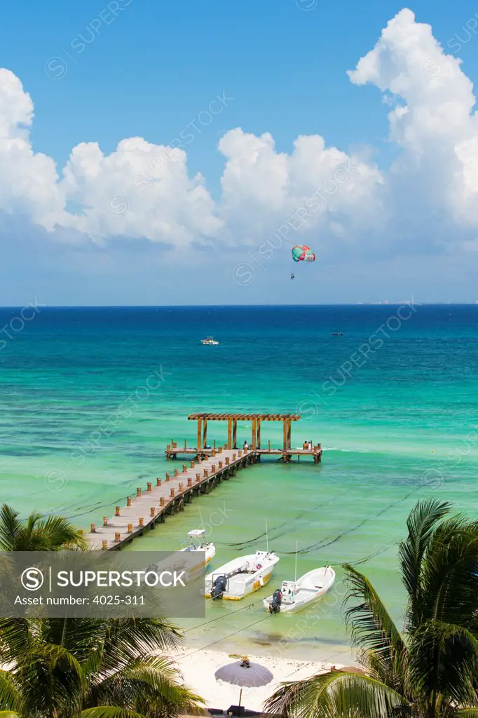 Mexico, Quintana Roo, Playa del Carmen, Pier at beach jutting out to sea at Playa del Carmen