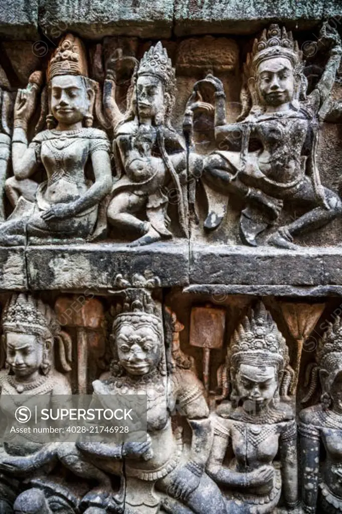 Siem Reap, Cambodia, stone reliefs depicting a Devata and Aspara, female spirits and guardians of Hindu and Buddhist mythology on the walls along the Terrace of the Leper King