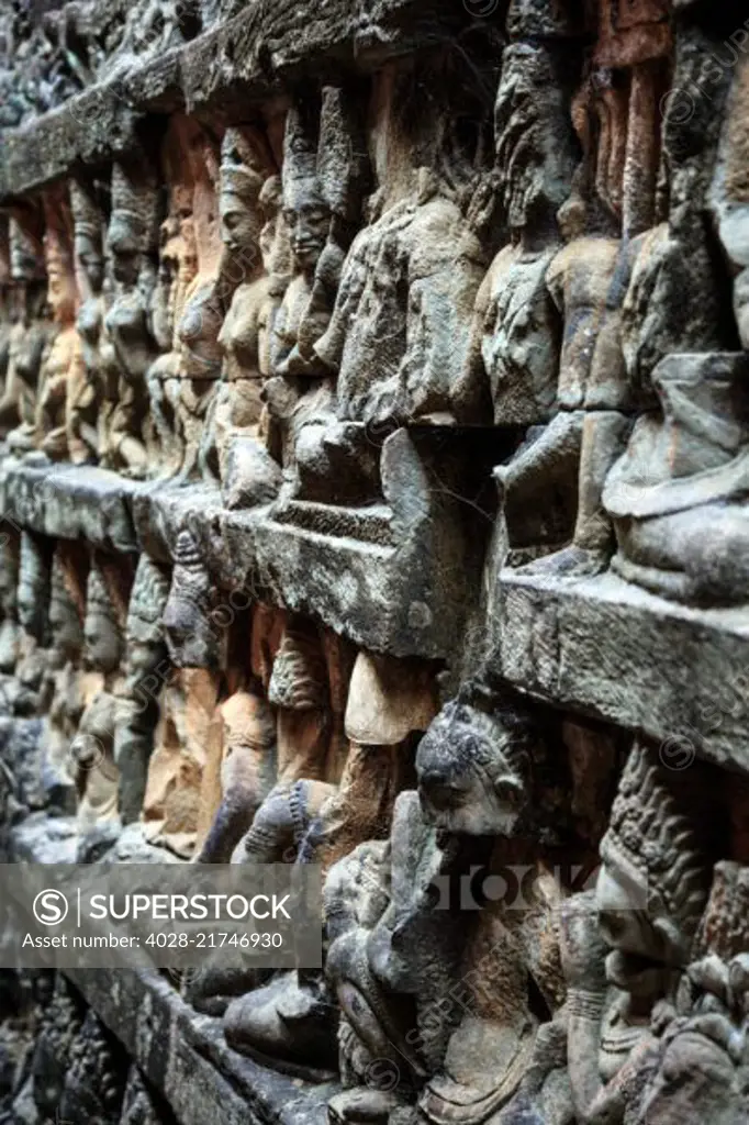 Siem Reap, Cambodia, stone reliefs depicting a Devata and Aspara, female spirits and guardians of Hindu and Buddhist mythology on the walls along the Terrace of the Leper King