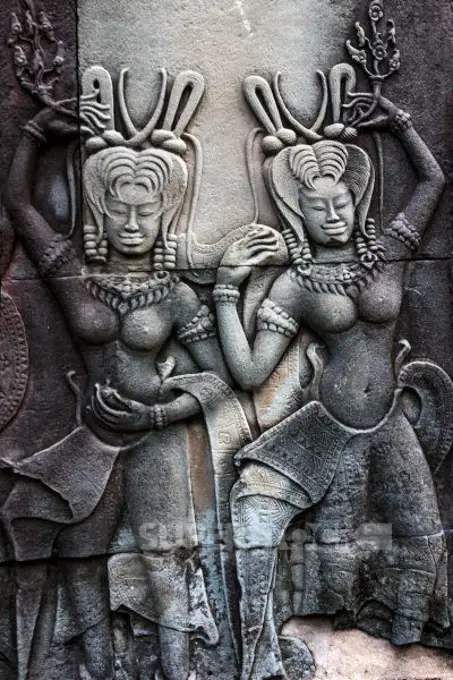 Siem Reap, Cambodia, stone reliefs depicting a dancing Apsara, a female spirit of the clouds and waters in Hindu and Buddhist mythology on the walls of the Angkor Wat temple