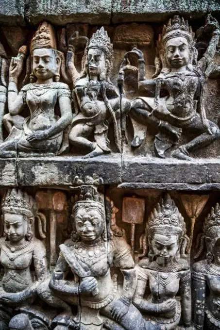 Siem Reap, Cambodia, stone reliefs depicting a Devata and Aspara, female spirits and guardians of Hindu and Buddhist mythology on the walls along the Terrace of the Leper King