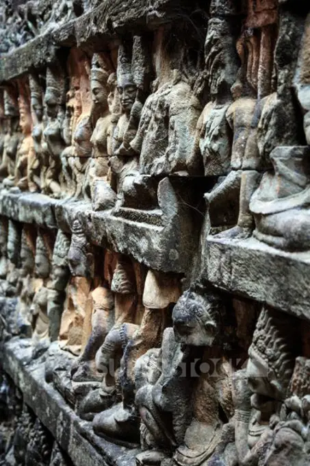 Siem Reap, Cambodia, stone reliefs depicting a Devata and Aspara, female spirits and guardians of Hindu and Buddhist mythology on the walls along the Terrace of the Leper King