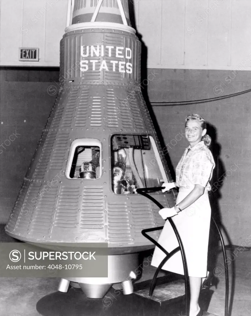 Astronaut Trainees Jerrie Cobb stands next to a Mercury spaceship capsule. Cobb passed all the training exercises, ranking in the top 2% of all astronaut candidates of both genders. After three years, Cobb left NASA for the jungles of the Amazon, where she has spent four decades as a solo pilot delivering food, medicine, and other aid to the indigenous people.