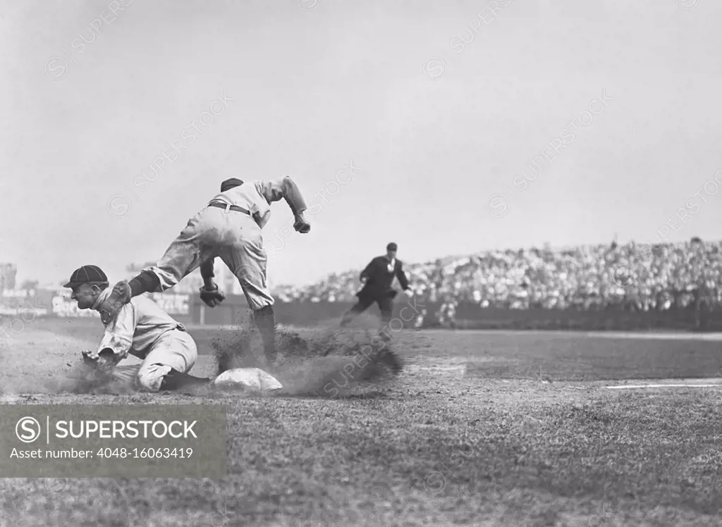 Ty Cobb steals third base and slides into Jimmy Austin, July 23, 1910. One writer noted that Cobb's speed and daring made him the terror of the opposing infield  (BSLOC_2018_3_142)