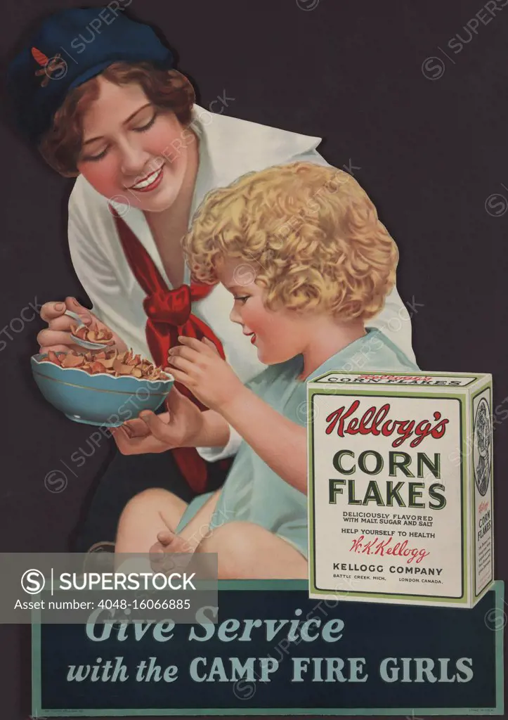 1929 advertisement for Kellogg's Corn Flakes, showing a Camp Fire Girl feeding cereal to a small child. In 1894 William Kellogg created corn flakes as healthy breakfast for Battle Creek Sanitarium, where his brother John was superintendent. John was a Seventh day Adventist, who ate a vegetarian diet, as did his patients. Following the cereals popularity at the sanitarium, William founded the Kellogg Company in 1896 to produce corn flakes with added sugar for the wider public  (BSLOC_2020_2_106)