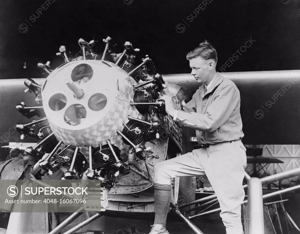 Lindbergh examining the cylinders of the Spirit of St. Louis before his Transatlantic Flight, May 1927  (BSLOC_2020_2_69)