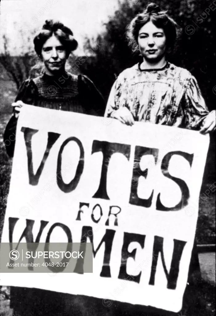 Suffragettes at turn of the last century holding Votes for Women picket sign, U.S., 1910s.