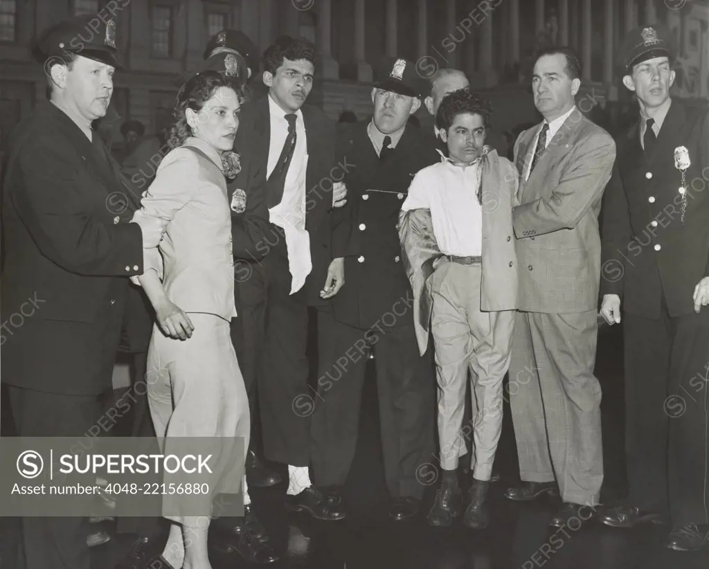 Puerto Rican Nationalists under arrest after shooting five Congressmen in the Capitol. In custody of police are Lolita Lebron, Rafael Cancel Miranda, and Andres Figueroa Cordero. March 1, 1954. - (BSLOC_2015_1_198)