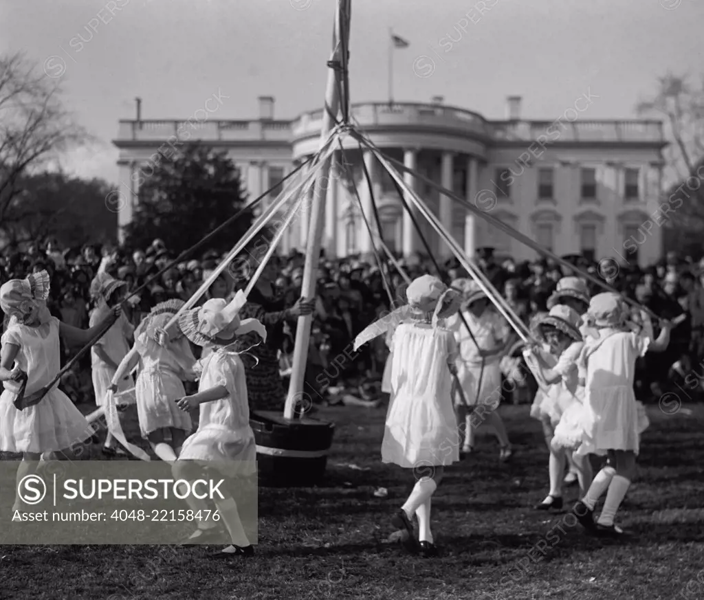 Children dance around a maypole at the White House Easter Celebration on April 1, 1929. First Lady Lou Hoover replaced the Easter Egg Roll with Folk Dancing, because she disliked egg stench that followed. (BSLOC_2015_16_88)