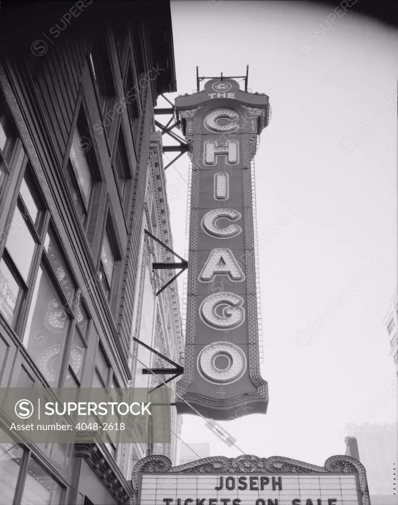 The Chicago Theater, constructed in 1921, photograph shows the sign and the Page Brothers building to the right, 175 North State Street, Chicago, Illinois, circa 1990s.