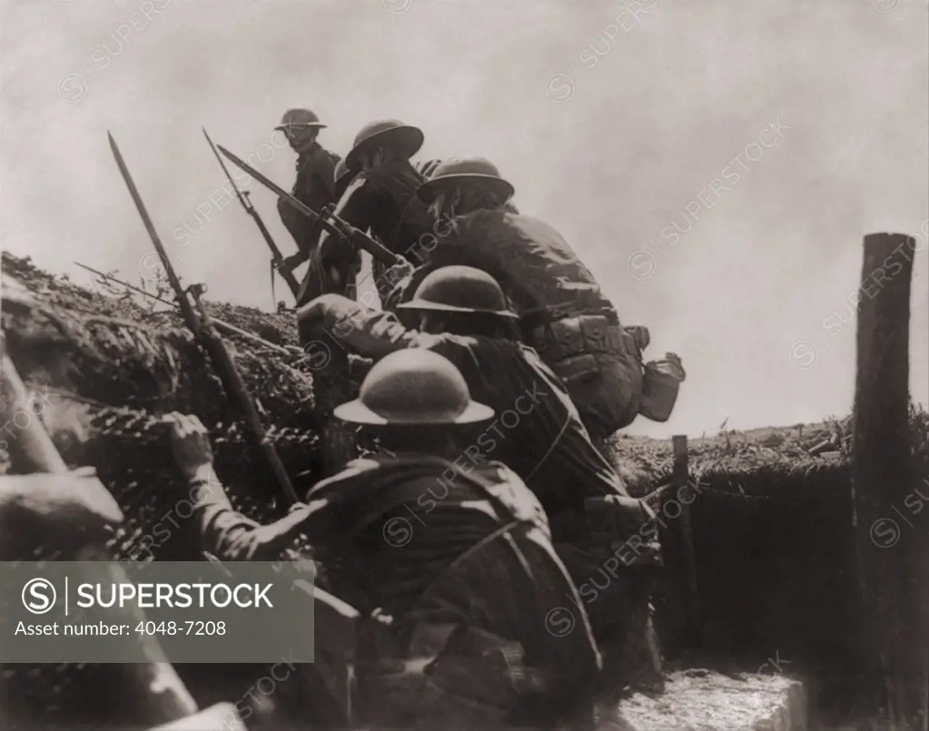 Allied soldiers climb out of the defensive trench to engage in battle on the Western front during World War I. Ca. 1917.