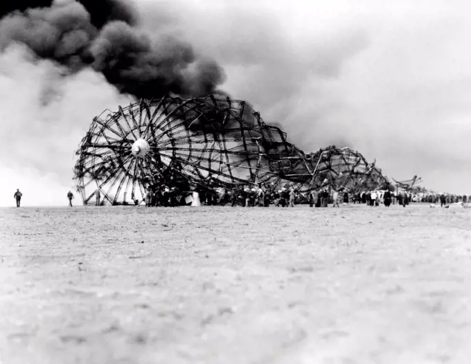 Hindenburg crash at Lake Hurst, New Jersey. The skeleton of the still burning Zeppelin on the ground after bursting in flames while landing. May 6, 1937.