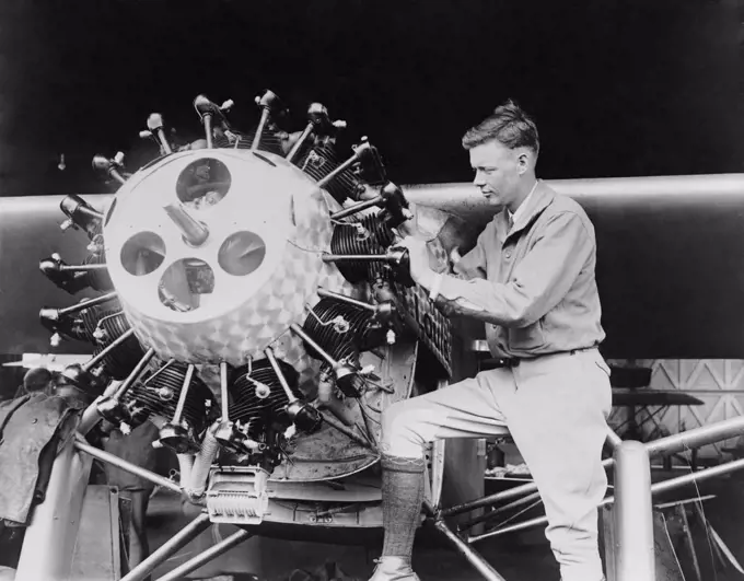 Lindbergh examining the cylinders of the Spirit of St. Louis before his Transatlantic Flight, May 1927  (BSLOC_2020_2_69)