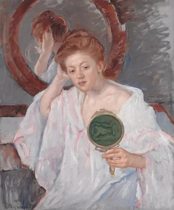 Denise at Her Dressing Table, by Mary Cassatt, 1908-9, French impressionist painting, oil on canvas. An auburn-haired young woman examines her hairdo with two mirrors in a painterly composition of warm browns, pinks and rich grays (BSLOC_2017_3_146)