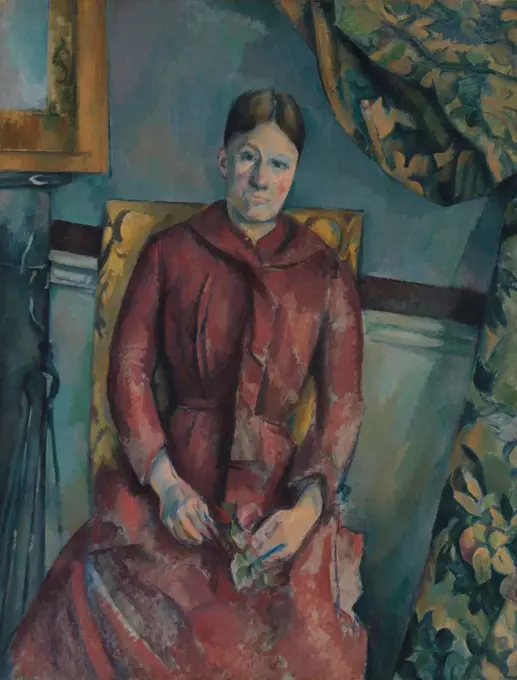 Madame Cezanne, by Paul Cezanne, 1888-90, French Post-Impressionist painting, oil on canvas. Portrait of the artist's wife wearing a red dress in a furnished interior of their rented apartment at 15 quai dAnjou in Paris (BSLOC_2017_5_17)