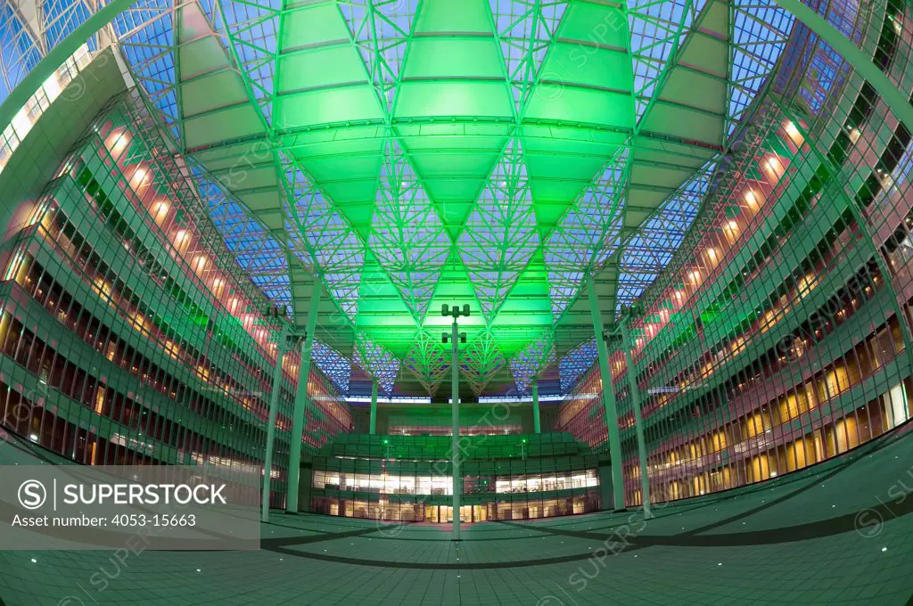 Bird's eye view of walkway with columned ceiling in illuminated modern office building. Taipei, Taiwan. 06/16/2006