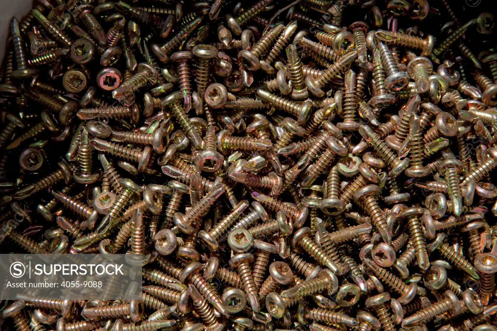 Metal screws used for steel framing at residential home construction site. Steel, while not a common material for residential framing, is 94% recyclable, has been milled locally for this project, and is a more sustainable choice than wood, which is typically used for residential building construction, Los Angeles, California, USA