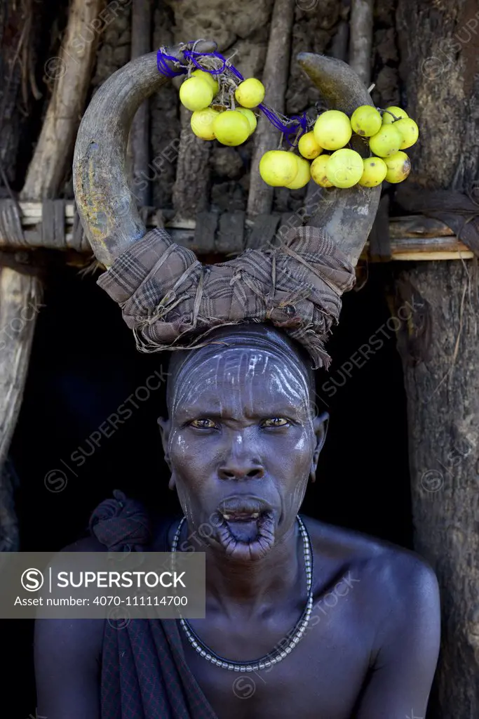 Woman wearing traditional headdress. Mursi tribe, Mago National Park. Omo Valley, Ethiopia.