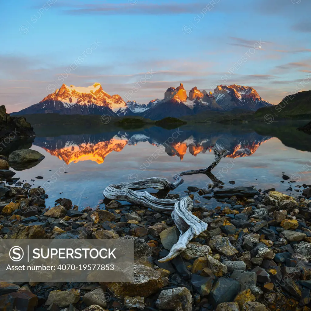 Towers and Central Massif reflected in Lago Pehoe at sunrise. Torres del Paine National Park, Patagonia, Chile. November 2018.