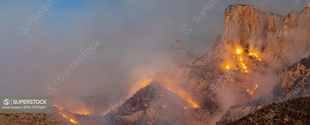 Lightning started fire in steep craggy terrain, Pusch Ridge, Santa Catalina Mountains, Coronado National Forest, Arizona, USA. 6th June 2020.