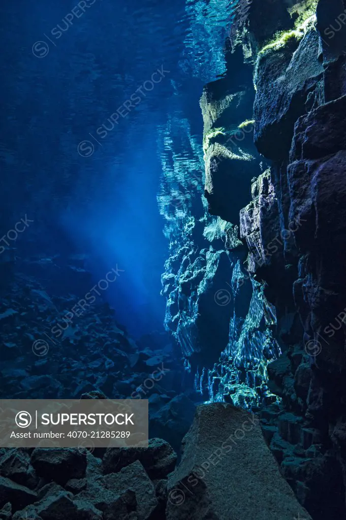 A view down Nikulasargj Canyon, deep fault filled with fresh water in the rift valley between the Eurasian and American tectonic plates at Thingvellir National Park, Iceland. May 2011. In this photo the American plate is on the right and the Eurasian plate is on the left.