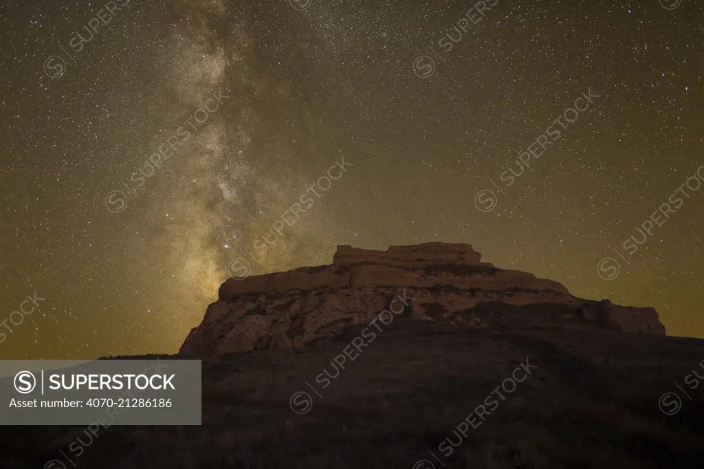 Courthouse rock at night with an arm of The Milky Way galaxy visible in the sky. Near Bridgeport, Nebraska, USA, September.