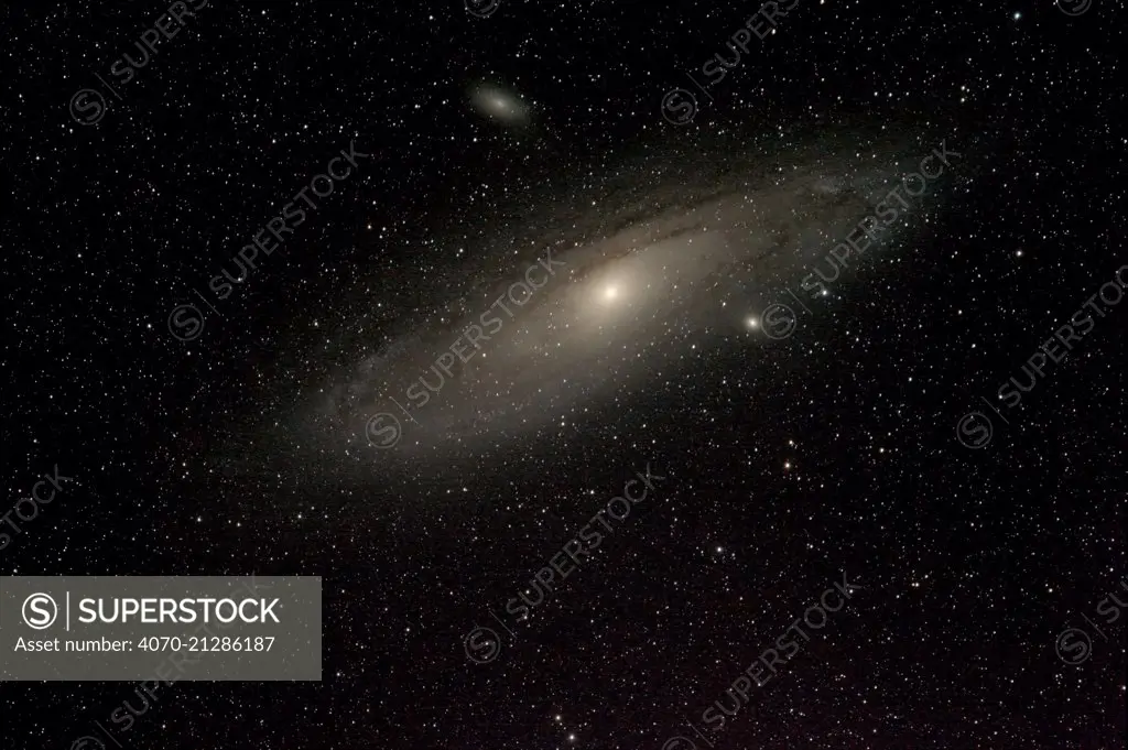 Andromeda galaxy and and sister galaxies M110 above and M32 below. Taken from eastern Colorado, USA, September 6-7 2013. Image taken with digital image stacking.