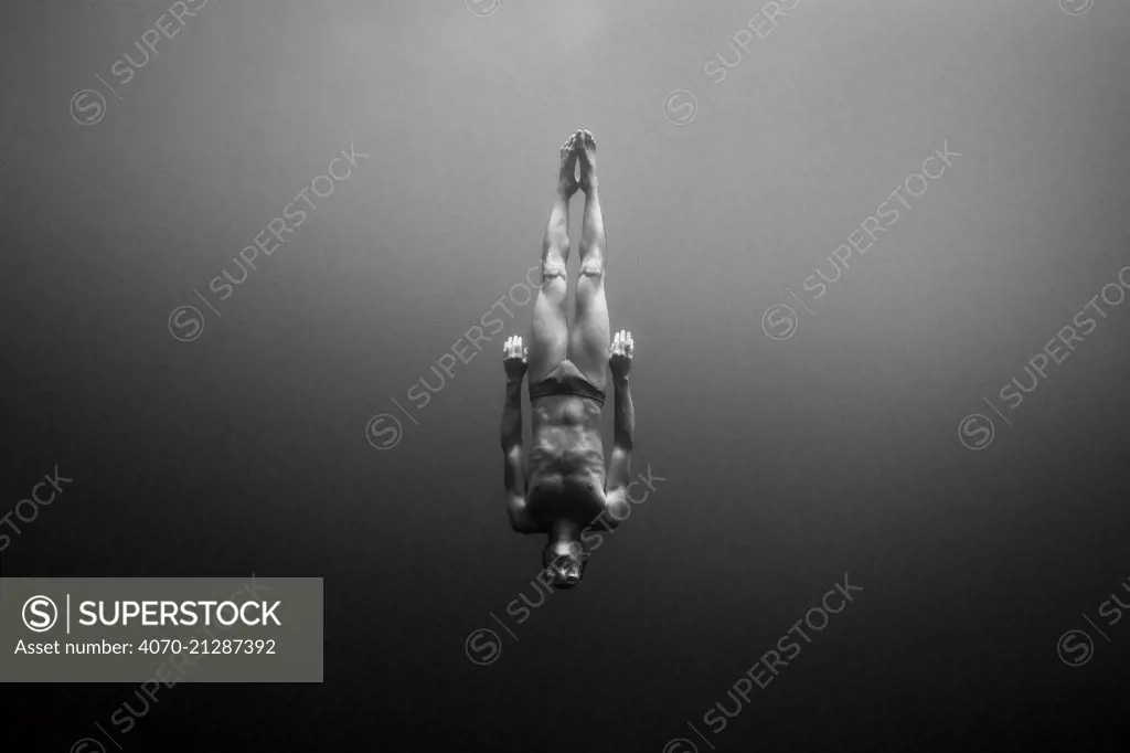 William Trubridge diving -  a world champion free diver who is campaigning to protect the Critically Endangered Maui's dolphin (Cephalorhynchus hectori maui) endemic to New Zealand. January 2008.  Editorial use only