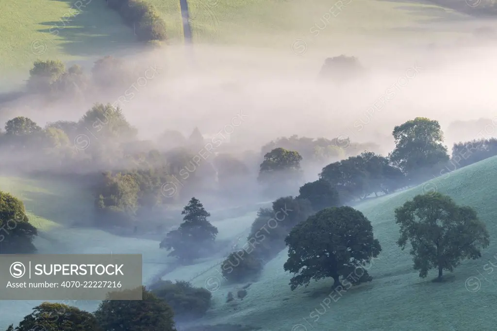 Misty morning view of Exmoor countryside from Winsford Hill, Exmoor National Park, Somerset, UK. October 2016.