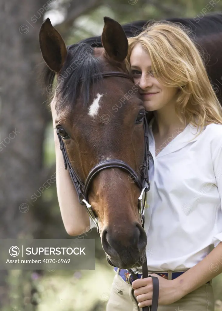 Woman with Bay Appendix Quarter horse gelding, Castle Rock, Colorado, USA, model released