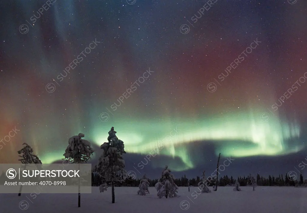 Aurora borealis colours in night sky, northern Finland, January, winter