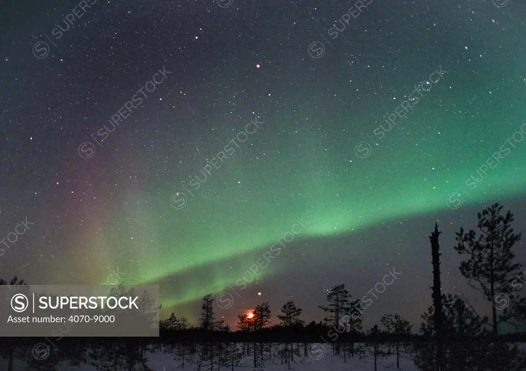 Aurora borealis colours, moon and Jupiter in night sky, northern Finland, winter 2002