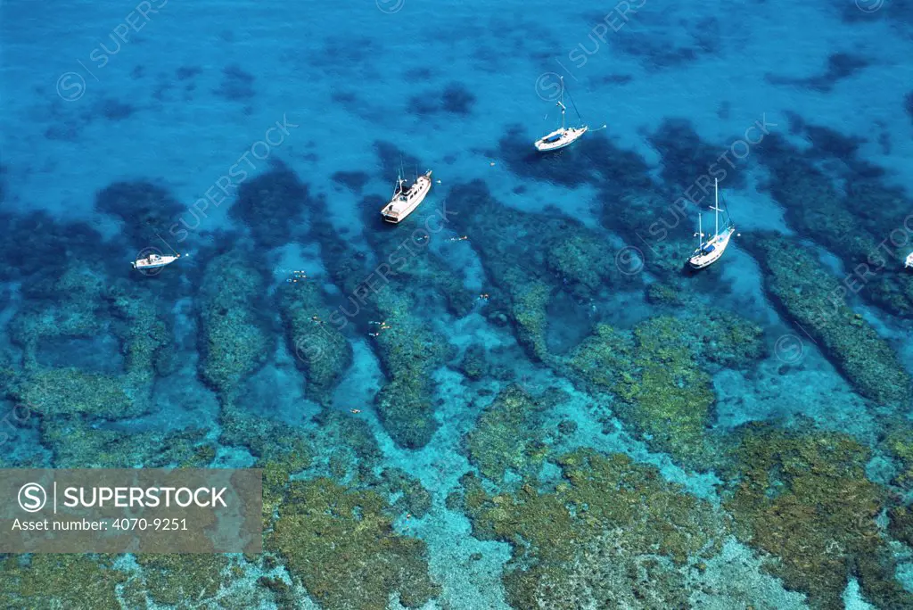 Aerial view of boats and snorkelers, Looe Key Reef, Florida Keys National Marine Sanctuary, USA, showing spur and groove coral formations.