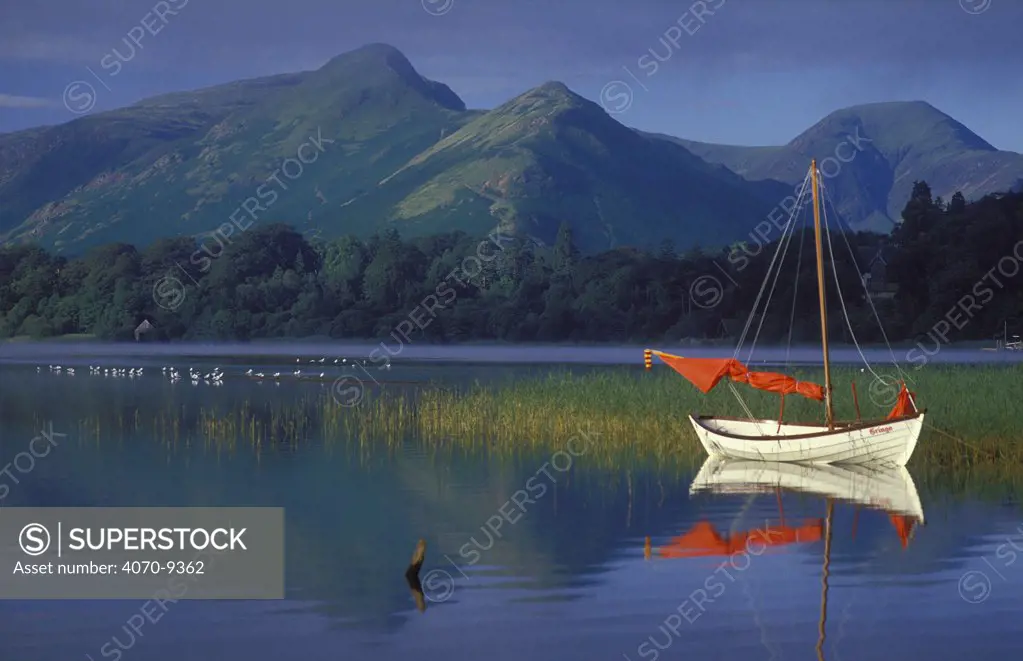 Boat with Red Sail, Derwent Water, Lake District National, Park, Cumbria, England. UK