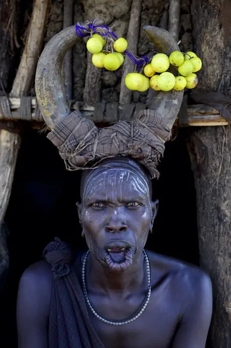 Woman wearing traditional headdress. Mursi tribe, Mago National Park. Omo Valley, Ethiopia.