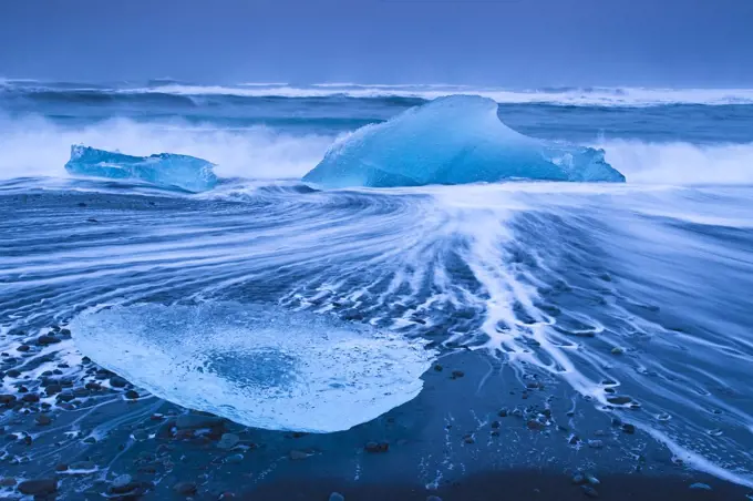 Ice washed up on Jokulsarlon, glacial lagoon, Skaftafell National Park, Iceland, February.