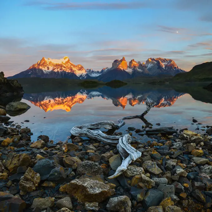 Towers and Central Massif reflected in Lago Pehoe at sunrise. Torres del Paine National Park, Patagonia, Chile. November 2018.